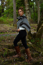 Outlander knitwear including a striped knitted cape