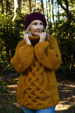 Chunky sweater with Celtic cable design