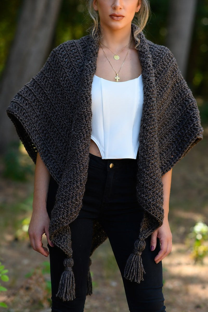 Crochet triangle shawl with tassels