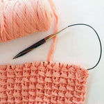 Peach mixtape yarn knitted to make the bamboo stitch