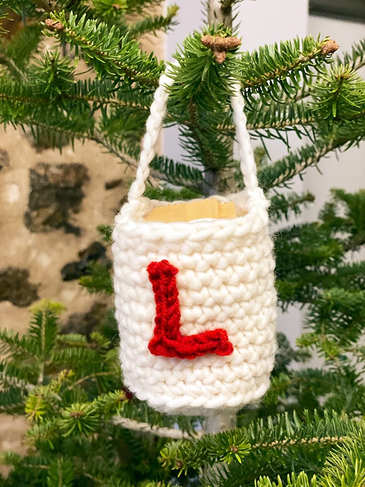 crochet bag with a crochet letter on it
