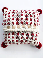 Pom poms added to the pillow cover