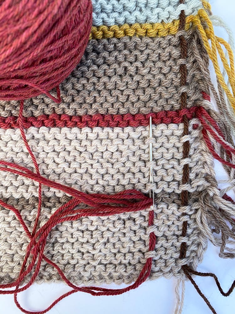 weaving tartan into the shawl