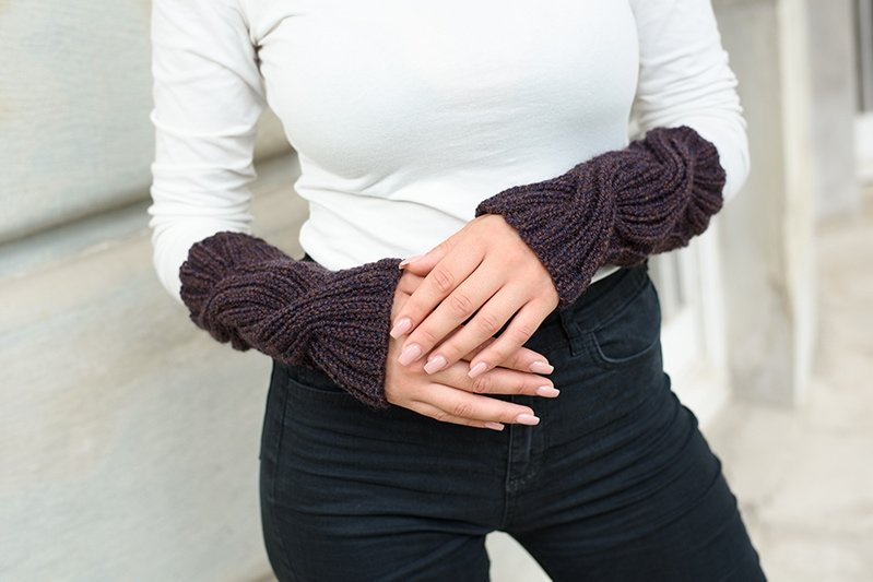 arm warmers with a cable knit design