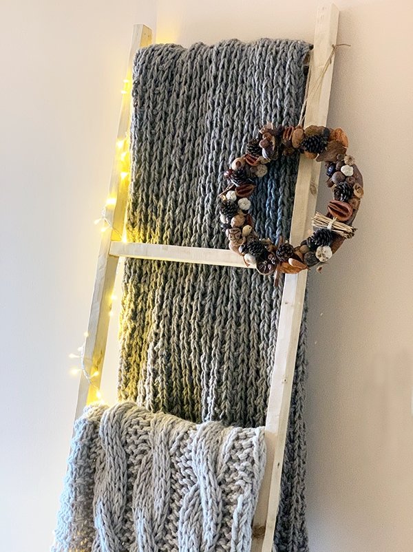 blanket ladder with hand knit blankets