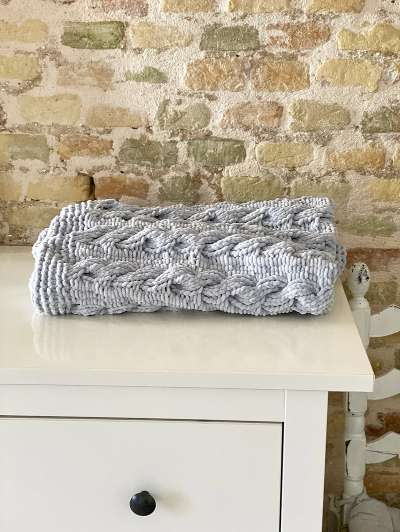 cable baby blanket folded