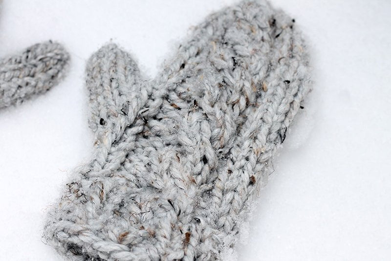 cable mittens in the snow