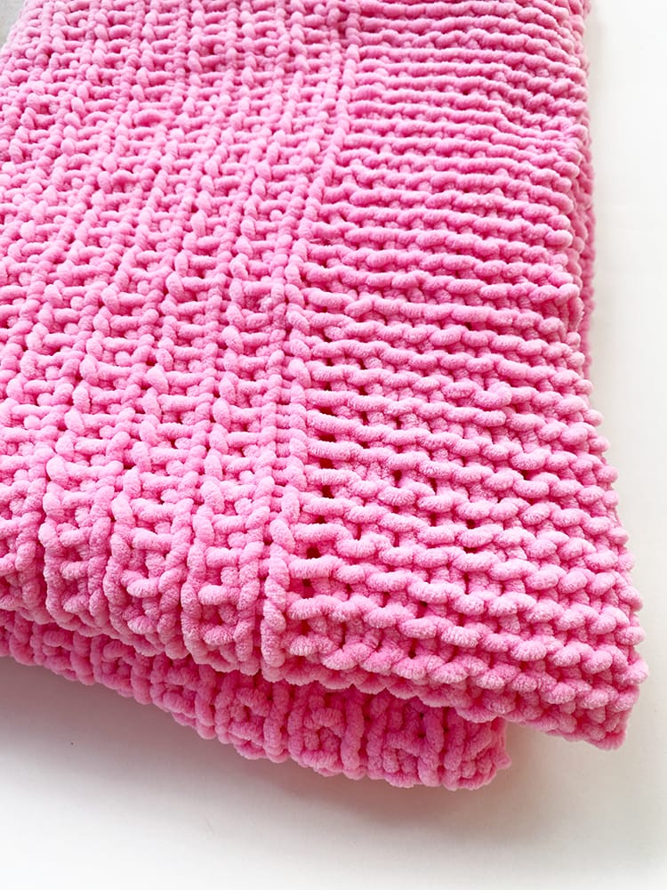pink knit baby balnket in chenille yarn