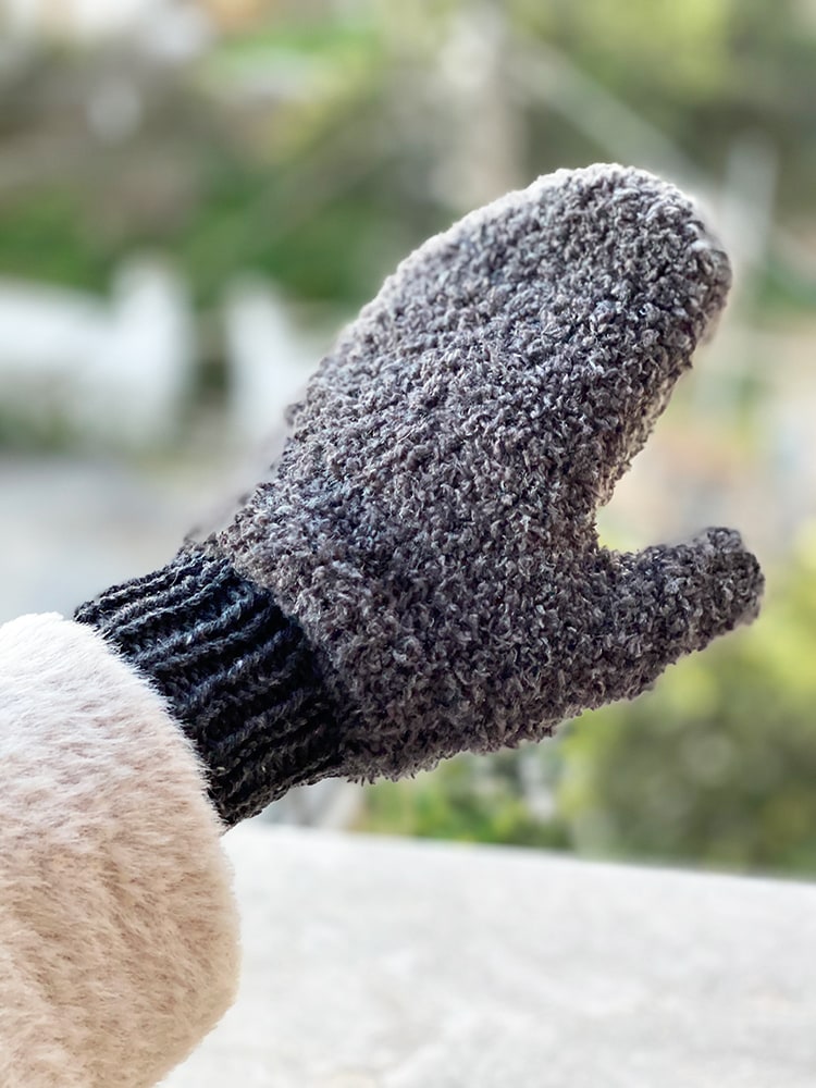 knitted mittens in textured grey yarn