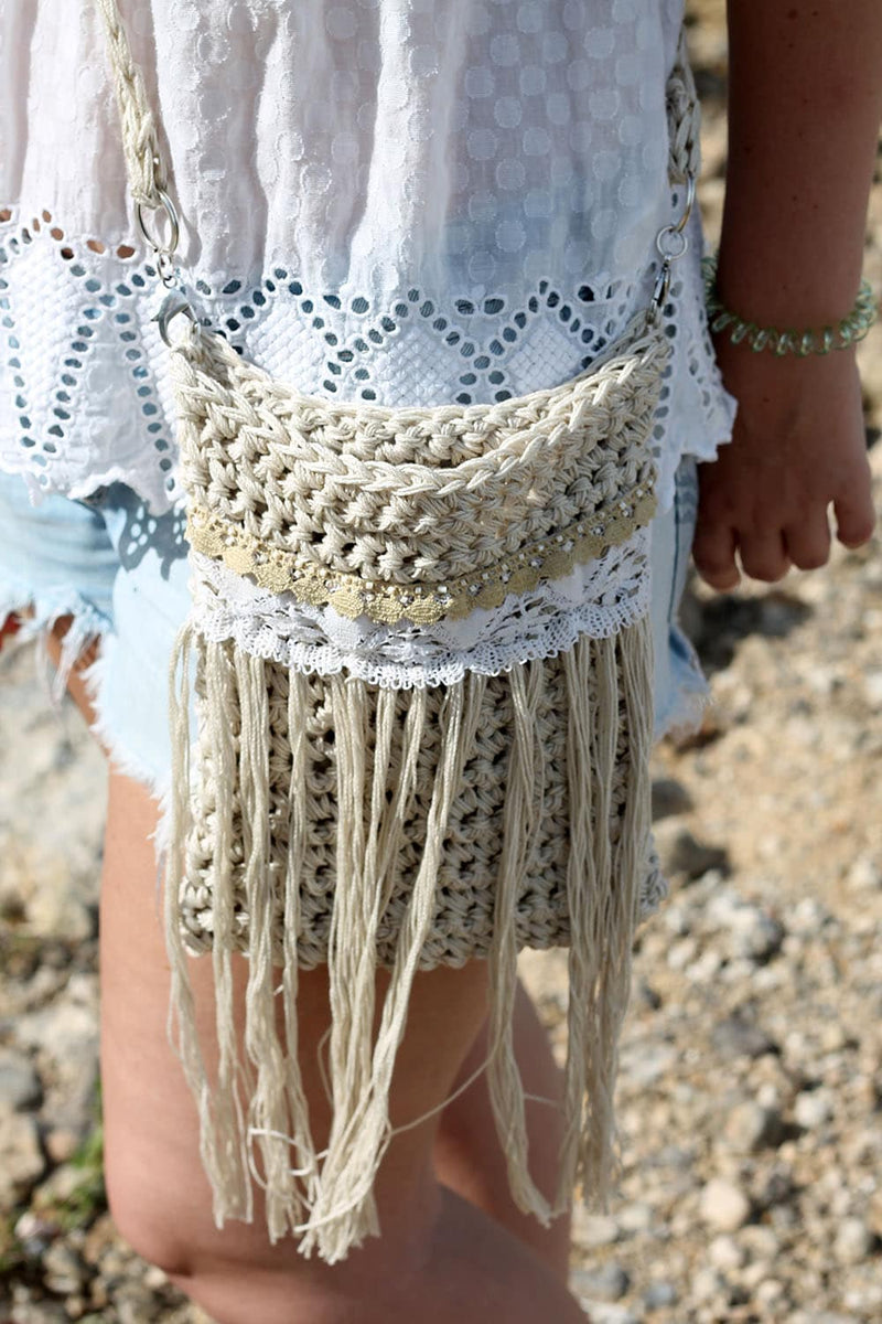 Girl wearing a crochet bag with long fringing