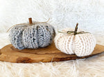 knitted pumpkins in grey and white yarn