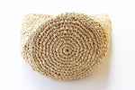 The circle base of the crochet raffia bag